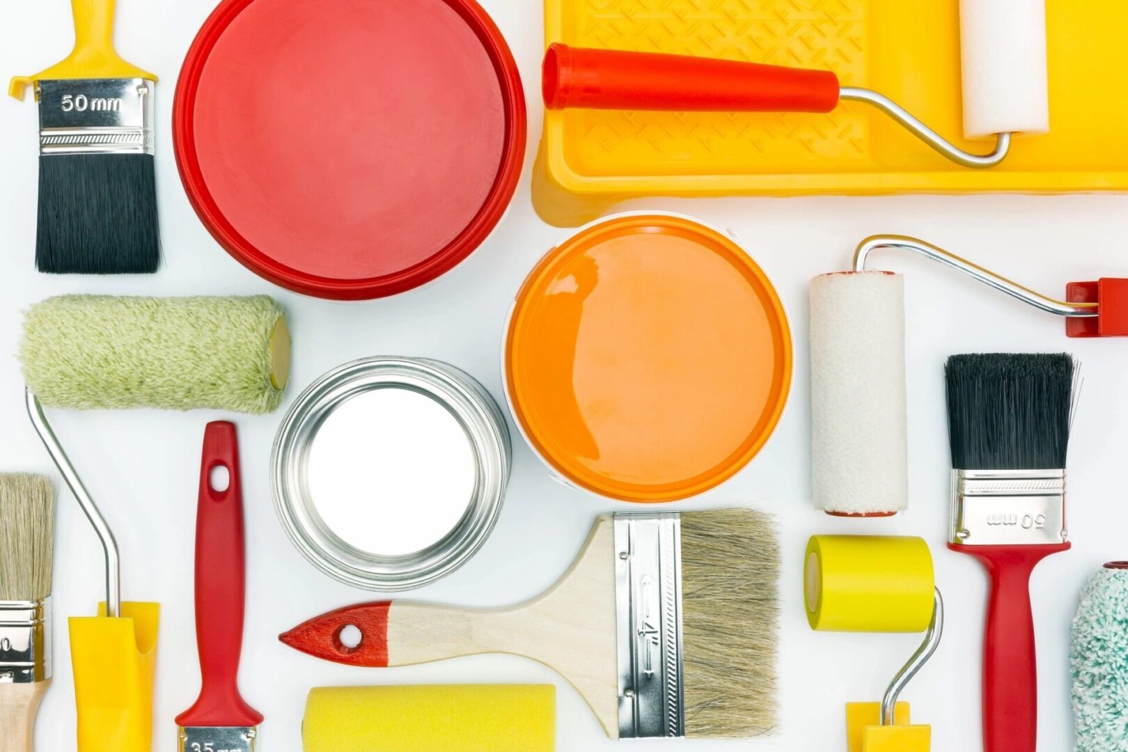 A group of paint supplies and tools on top of a table.