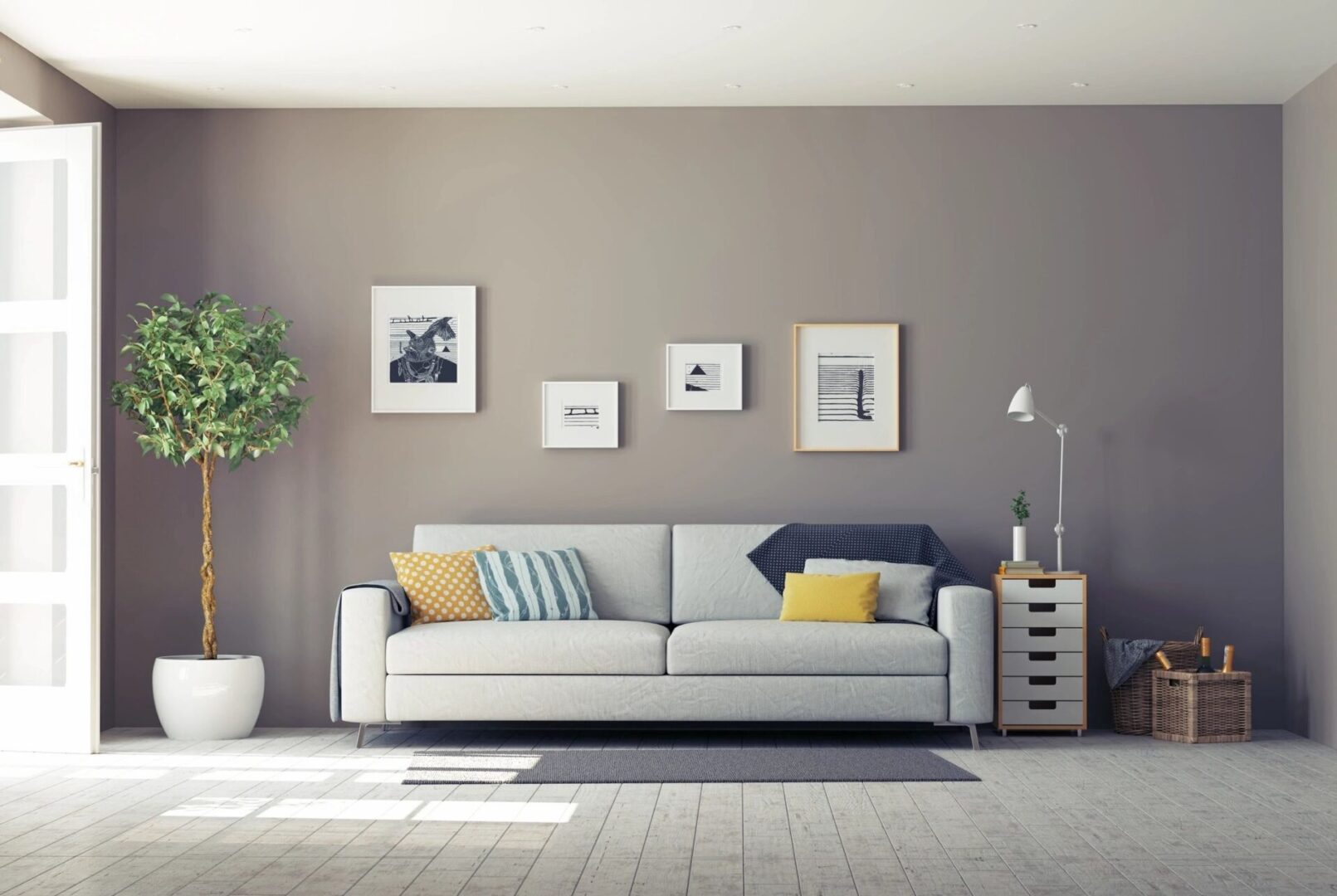 A living room with a couch and pictures on the wall