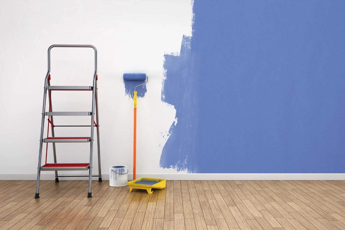 A room with blue walls and yellow ladder.